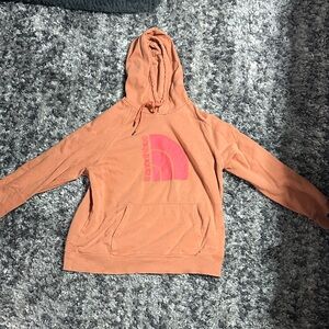 The North Face Orange Hoodie with White Logo